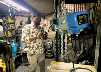 Technician explaining a gearbox assembly to a customer